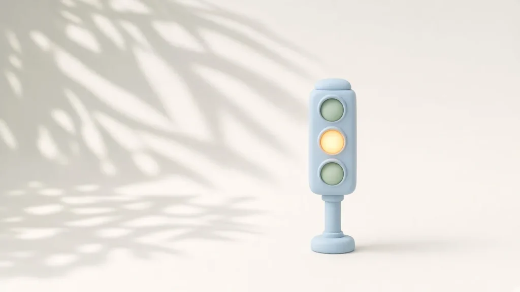 Claude Code auto mode temporarily unavailable: a small clay traffic light with the amber light on, soft light and leaf shadows