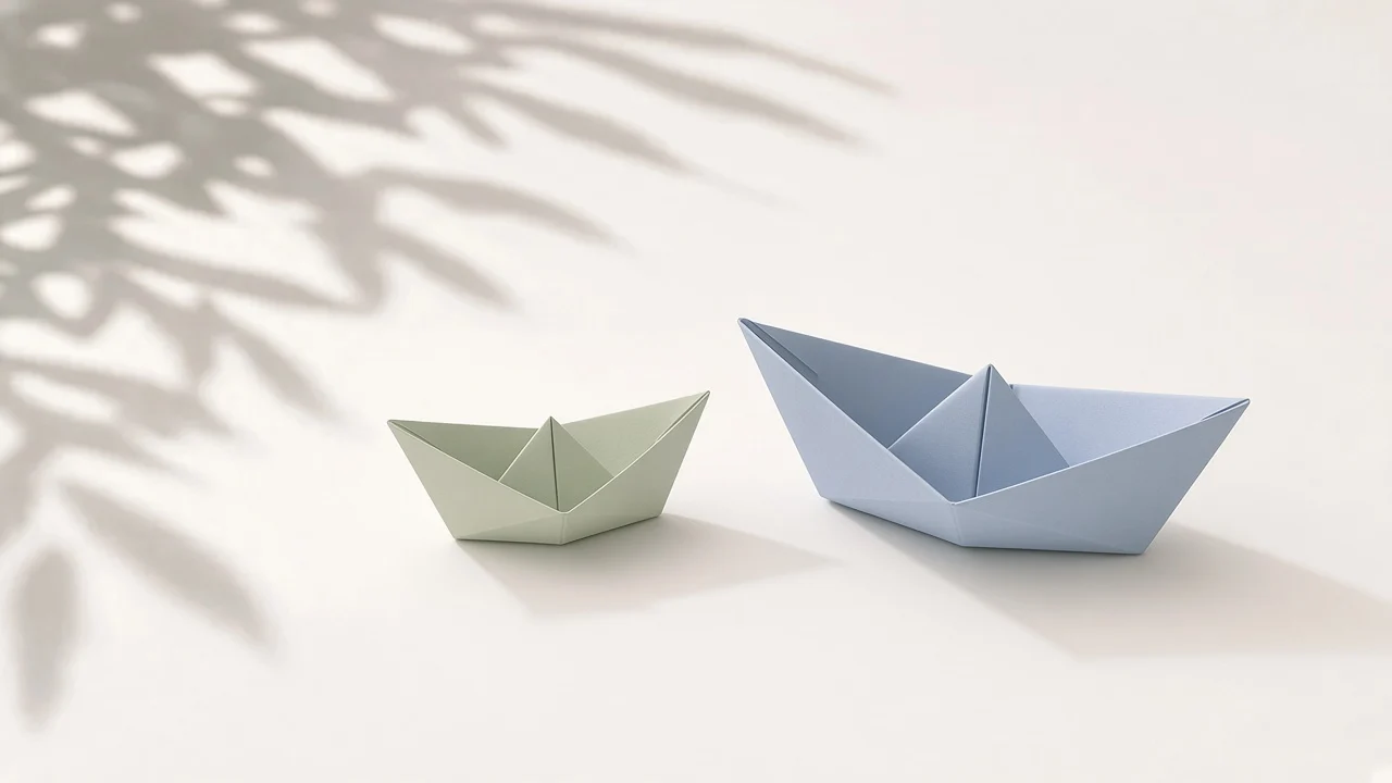 DGX Spark vs Mac Studio: a small pale green paper boat next to a larger pale blue paper boat